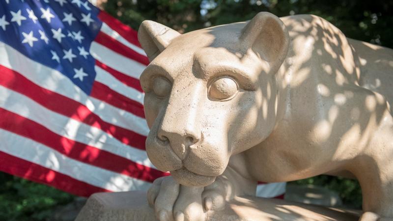 American flag behind Nittany Lion Shrine